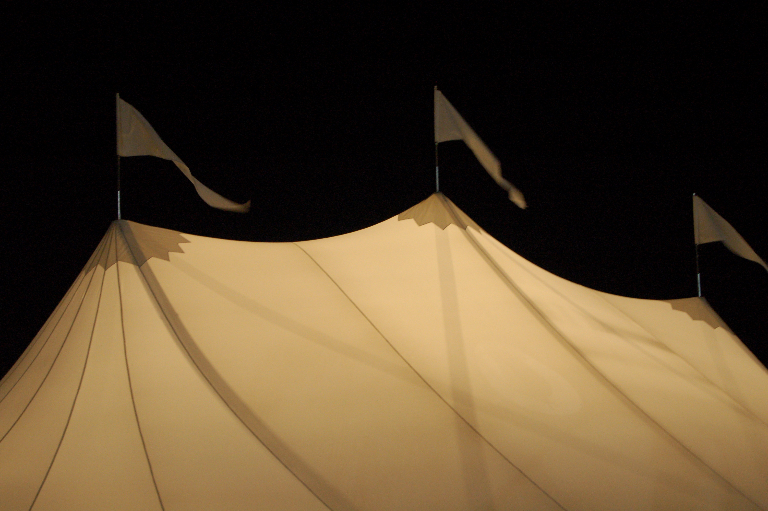 Tidewater Sailcloth Tent Flags at Night